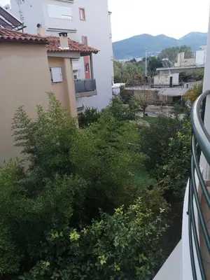 a view from the balcony of a building with bushes at Athenian Luxury apartment, near metro station Chalandri, Nu 1 in Athens