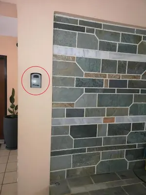 a stone wall with a tv on a wall at Athenian Luxury apartment, near metro station Chalandri, Nu 1 in Athens