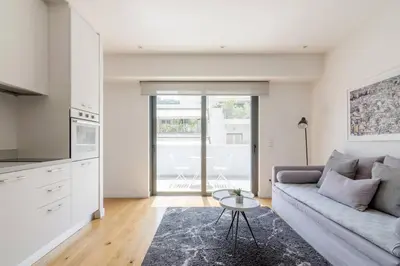 a living room with a couch and a table at Athens Trikoupi Suite E1 in Athens