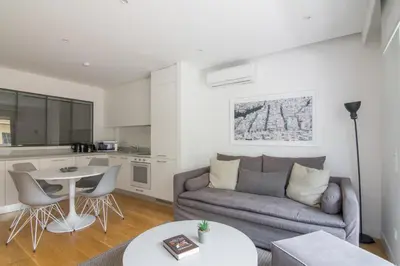 a living room with a couch and a table at Athens Trikoupi Suite B3 in Athens