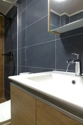 a bathroom with a white sink and a shower at You & Me Cozy Apartments BY ZAIN in Athens