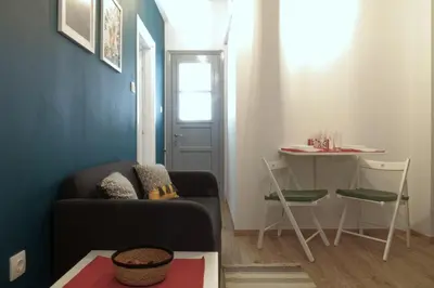 a living room with a couch and a table at You & Me Cozy Apartments BY ZAIN in Athens