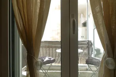 a sliding glass door with a view of a balcony at You & Me Cozy Apartments BY ZAIN in Athens