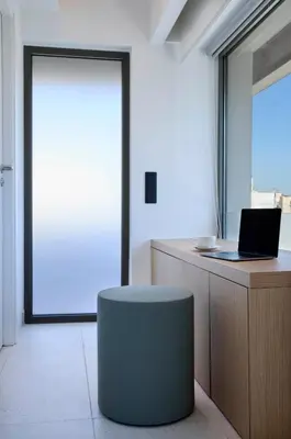 an office with a desk with a laptop and a stool at Twinn Downtown Piraeus, Santikos Collection in Piraeus