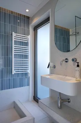 a bathroom with a sink and a mirror at Twinn Downtown Piraeus, Santikos Collection in Piraeus