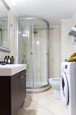 a bathroom with a shower and a toilet and a sink at Sympatico Central Apartment in Athens in Athens