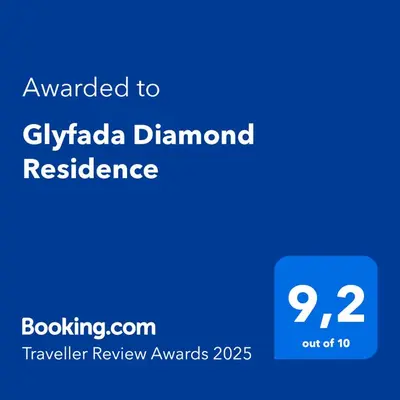 a blue sign with the words awarded to gilaala channelresidence with at Glyfada Diamond Residence - 3 Master Bedrooms in Athens