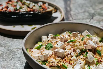 a dish of food in a pan on a table at Athenarum Portus Life & Style Hotel in Piraeus