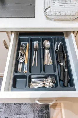 a tray of utensils in a drawer in a kitchen at Peaceful moments in Athens
