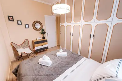 a bedroom with a bed with two towels on it at Peaceful moments in Athens