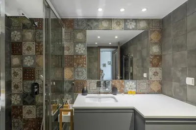 a bathroom with a sink and a mirror at Stratum Apartment by LobbySquare in Athens
