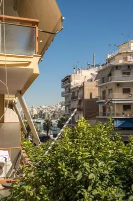 a view of the city from the balcony of a building at Luxury Serenity in Piraeus