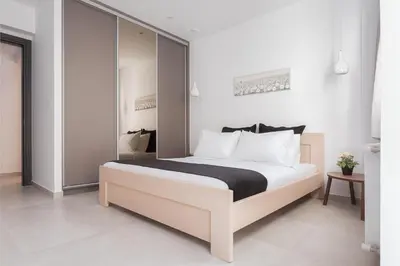 a bedroom with a large bed in a room at Acropolis Urban Life in Athens
