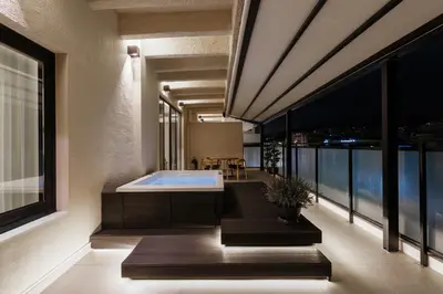 a bathroom with a bath tub on a balcony at ACRON 12 penthouse Acropolis suites in Athens
