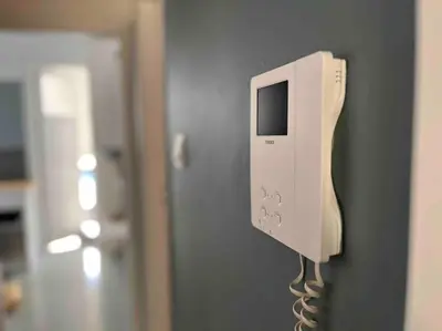 a phone is hanging on a wall at Stylish Central Cozy one BEDROOM Apartment in Athens