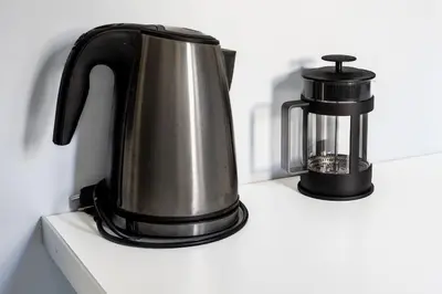 a black and silver coffee maker on a counter at Stylish Central Cozy one BEDROOM Apartment in Athens