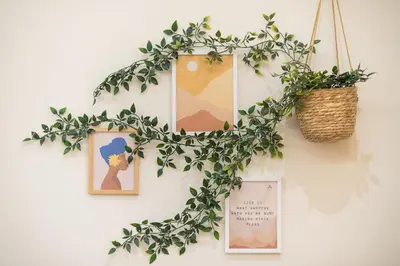 a wreath on a wall with pictures and a basket at Exclusive Mavili Suite by CloudKeys in Athens