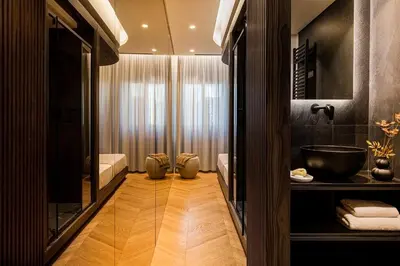 a bathroom with a tub and a sink and a mirror at Bullet Athens in Athens