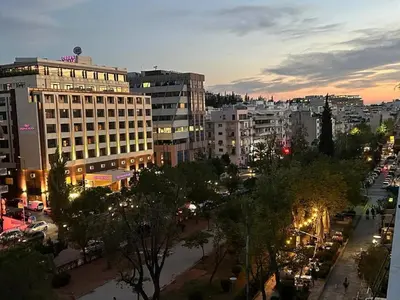 a view of a city at night with buildings at Bullet Athens in Athens