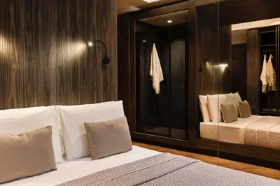a bedroom with a bed with a glass wall at Bullet Athens in Athens