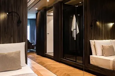a bedroom with a bed and a glass wall at Bullet Athens in Athens