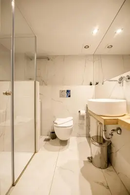 a bathroom with a toilet and a sink and a shower at the Artistic One-Bedroom Studio in Plaka in Athens