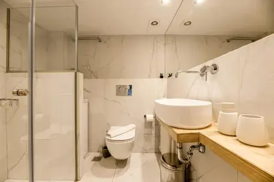a bathroom with a toilet and a sink and a shower at the Artistic One-Bedroom Studio in Plaka in Athens