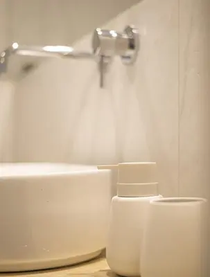 a white bathroom with a toilet and a sink at the Artistic One-Bedroom Studio in Plaka in Athens