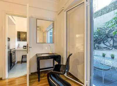 a home office with a desk and a chair at the Artistic One-Bedroom Studio in Plaka in Athens