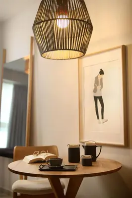 a table with a chandelier and a table with cups at Happiness Luxury Central Apartment in Athens