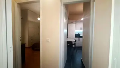 an empty room with a kitchen and a hallway at Apartment in Athens, Kallithea in Athens