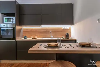 a kitchen with a counter with two dishes on it at Modern and Cozy apartment in the heart of Athens in Athens
