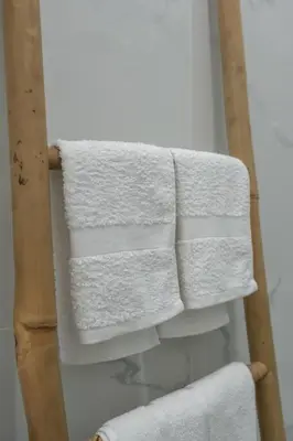 a group of white towels hanging on a wall at JV Luxury Apartment Acropolis in Athens