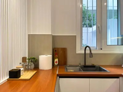 a kitchen with a sink and a counter top at Cozy studio near Flisvos Marina in Athens