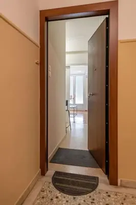 an open door to a hallway with a hallwayngthngthngthngthngthngthngth at kerameikos 2 bedroom apartment in Athens