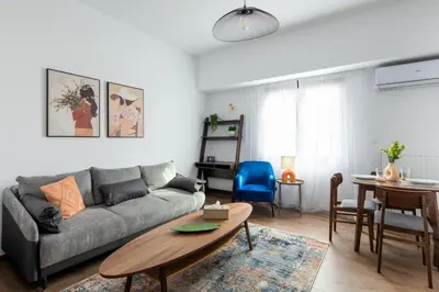a living room with a couch and a table at Alex 2 Bedroom Apartment in Athens in Athens