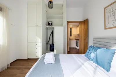 a bedroom with a bed with towels on it at Alex 2 Bedroom Apartment in Athens in Athens