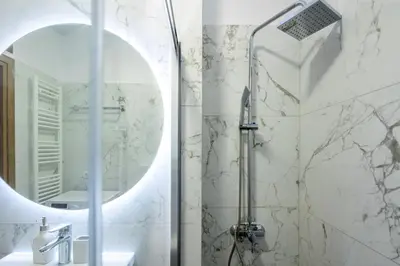 a bathroom with a shower and a mirror at Alex 2 Bedroom Apartment in Athens in Athens
