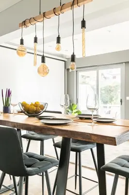 a dining room with a wooden table and chairs at Eclipse Riviera Cinema in Athens
