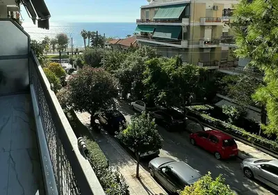 a view of a street with cars parked in a parking lot at Sea View Studio in Athens