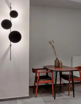 a dining room with a table and chairs at Jasmine Luxury Apartment in Athens