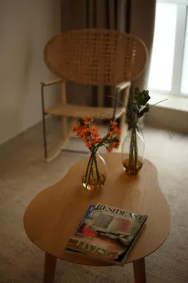 a wooden table with two vases and flowers on it at Central Luxury Apartment Love in Athens