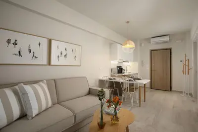 a living room with a couch and a table at Central Luxury Apartment Love in Athens