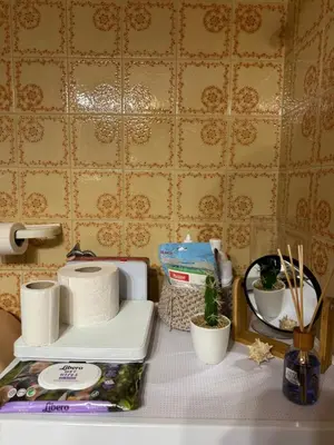 a counter top with toilet paper and a toaster at Apollo Apartment Athens/Airport in Spáta