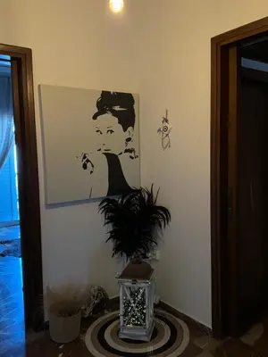 a room with a picture of a boy on the wall at Apollo Apartment Athens/Airport in Spáta