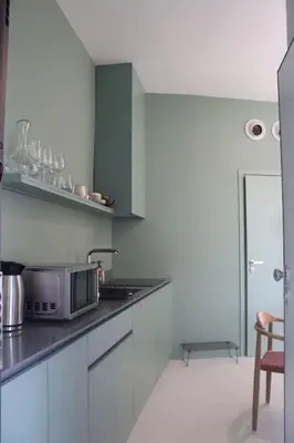 a kitchen with a sink and a microwave at Penthouse with Private Rooftop and Hot Tub in Athens