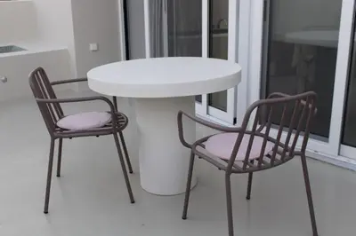 two chairs and a table and a table and chairs at Penthouse with Private Rooftop and Hot Tub in Athens
