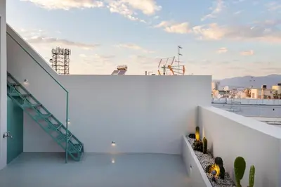 a view from the roof of a building with a staircase at Penthouse with Private Rooftop and Hot Tub in Athens