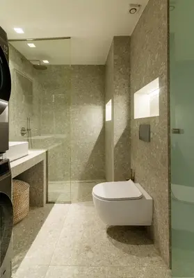 a bathroom with a toilet and a glass shower at Kolonaki Square Central Penthouse in Athens
