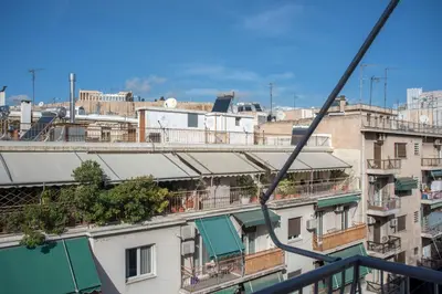 a view of a city from a building at Acropolis view apt in Koukaki in Athens
